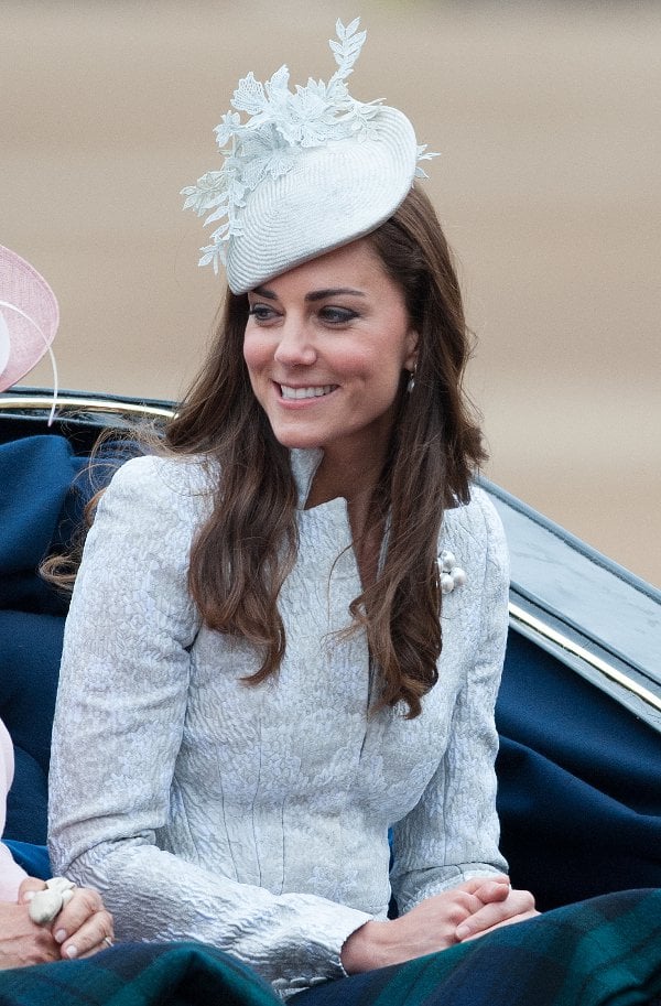 Catherine, Duchess of Cambridge, in a blue jacquard silk blazer and skirt by Alexander McQueen
