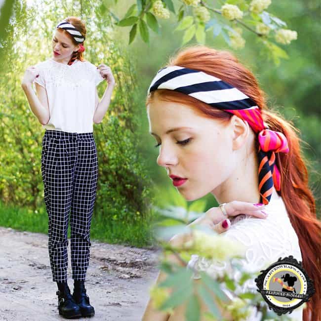 Evamaria adds a touch of elegance to her monochrome ensemble with a stylish scarf headband