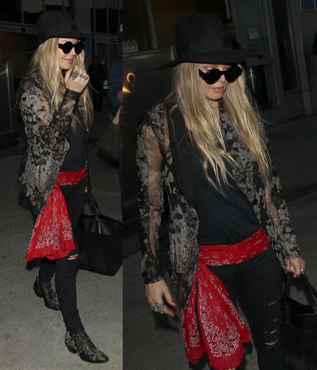 Fergie arrives at LAX decked in a red paisley print scarf