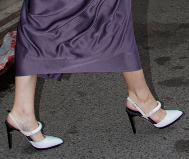 Jaime King completed her look with chic white slingback pumps featuring a pointed toe, ankle straps, and a sleek black stiletto heel for a striking contrast