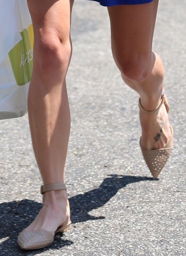 Ashley Greene's legs in nude flat shoes by Sam Edelman