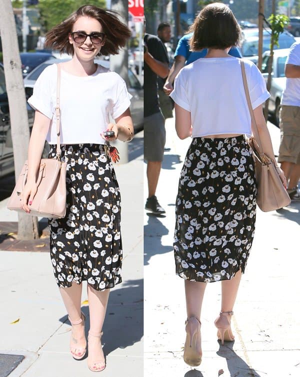 On July 3, 2014, in Los Angeles, Lily Collins showcased a chic summer ensemble featuring an Ella Moss poppy fields print skirt, a Sydney cropped top accessorized with a Prada Saffiano Lux tote in nude, a unique Prada Flame Saffiano leather trick keychain, and an elegant Ippolita Rock Candy Lollipop bangle in black onyx