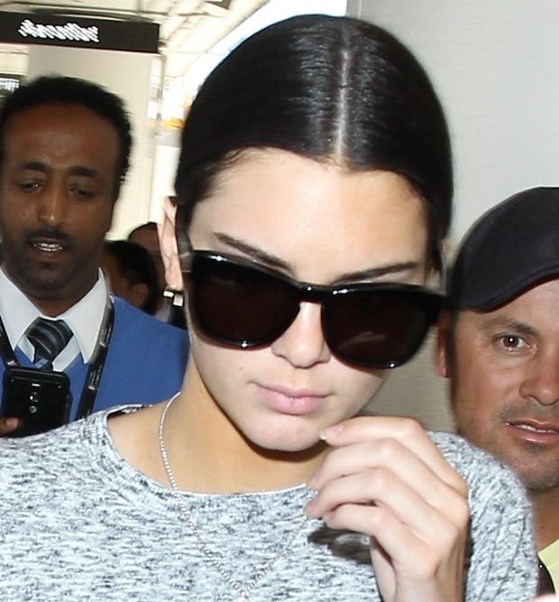 Kim Kardashian and Kendall Jenner arrive at LAX