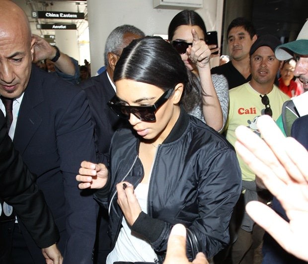 Kim Kardashian and Kendall Jenner arrive at LAX