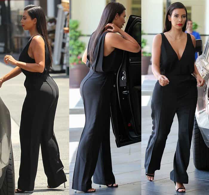 Kim Kardashian wearing a V-neck black jumpsuit