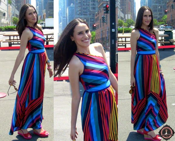 Mercedes styled her multicolored maxi dress with red shoes