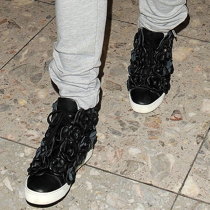 Rita Ora wearing Chanel Camellias sneakers