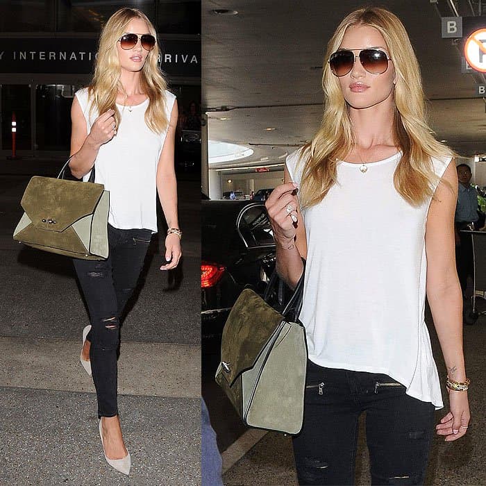 Rosie Huntington-Whiteley exudes effortless elegance in Paige Denim’s black ripped jeans and a white top, paired with chic beige pumps and a stylish handbag at LAX Airport