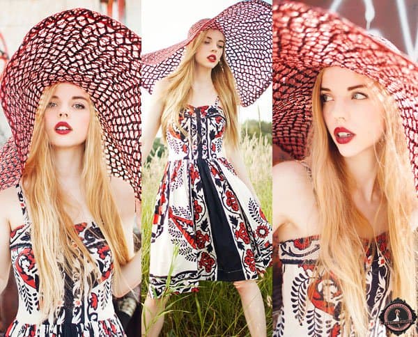 Ruby wears red lipstick with a colorful dress in red, black, and white