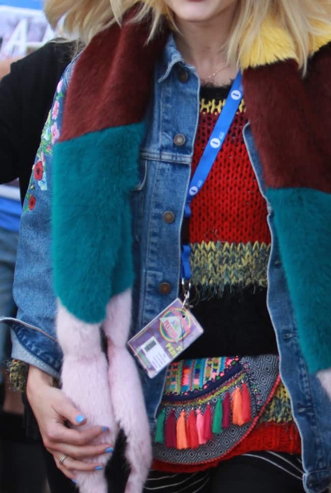 Fearne Cotton wears a colorful jumper with an embroidered denim jacket and a multi-hued fur scarf