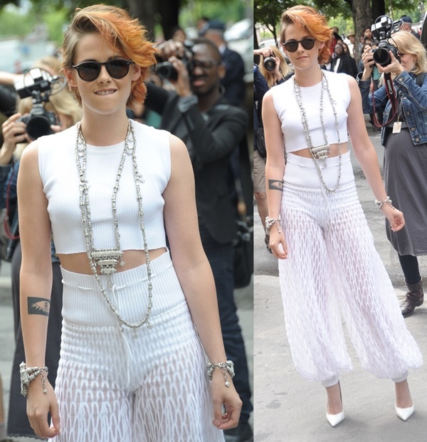 Kristen Stewart's all-white look included a crop top, high-waisted Chanel Resort 2015 sheer pants, and Christian Louboutin So Kate pumps