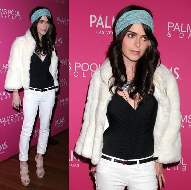 Taryn decked herself in black-and-white separates consisting of a black tank top worn under white skinny jeans and a white fur jacket