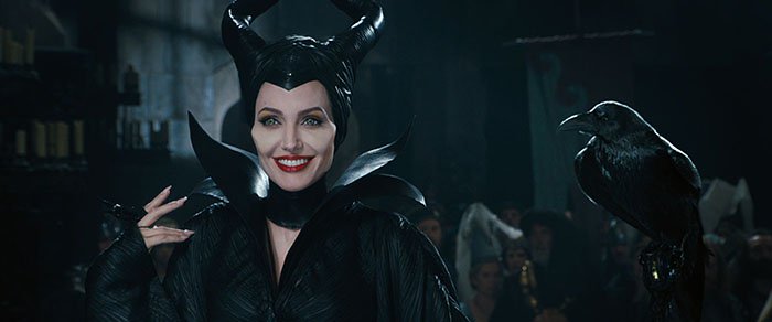 Angelina Jolie as Maleficent and her shapeshifting crow, Diaval, in a still from Walt Disney Pictures' 2014 film Maleficent