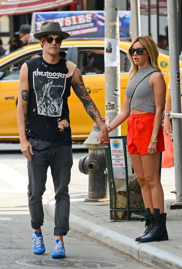 Ashley Tisdale and fiancé Christopher French hold hands in New York City on July 30, 2014