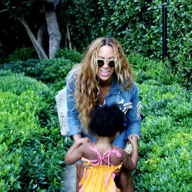Beyonce playing with her two-year-old daughter Blue Ivy and showing off her curvaceous body on Instagram