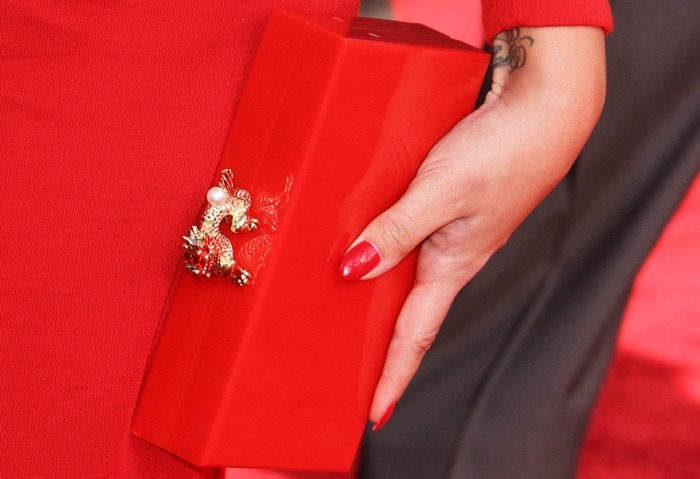 Demi Lovato toting a Charlotte Olympia "Dragon" clutch