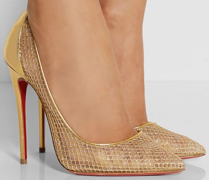 Finished with the unmistakable red sole, this pair is crafted from gold leather and glitter-finished fishnet fused onto a sheer mesh