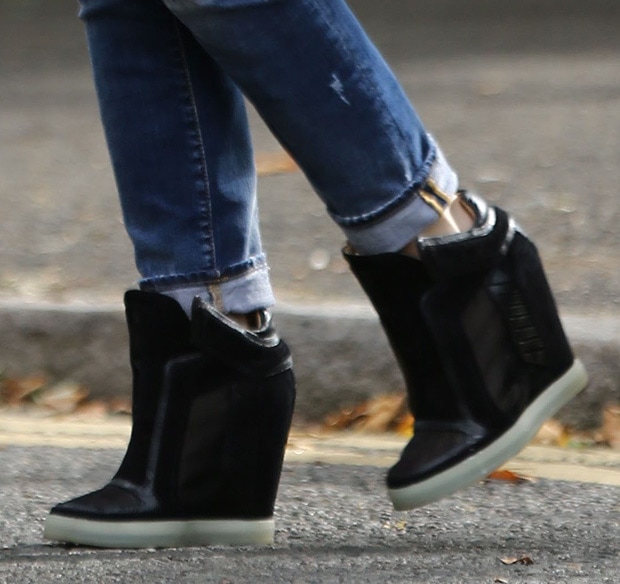 Gwen Stefani wearing L.A.M.B. wedge sneakers