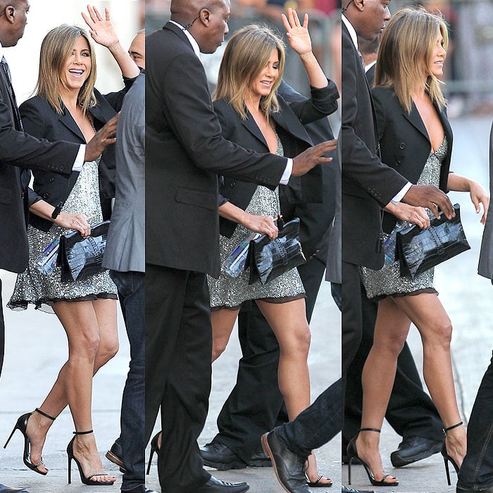 Jennifer Aniston's baby-doll fit and clingy fabric dress gave Jen what seemed to be a tiny baby bump