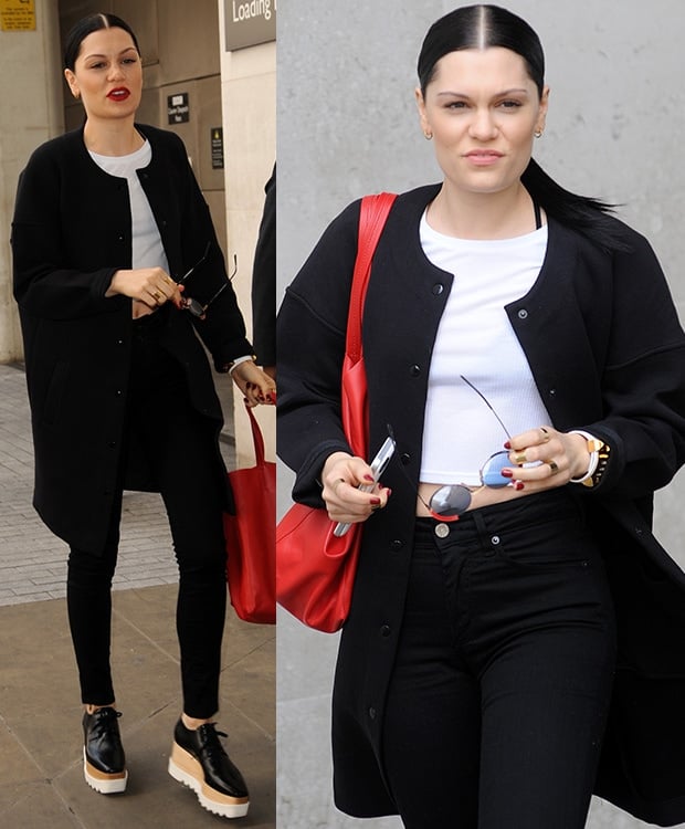 Jessie J styled a white cropped top with high-waisted black pants and a black coat