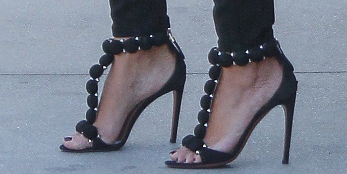 Kim Kardashian shows off her feet in Alaia black suede stud t-strap sandals