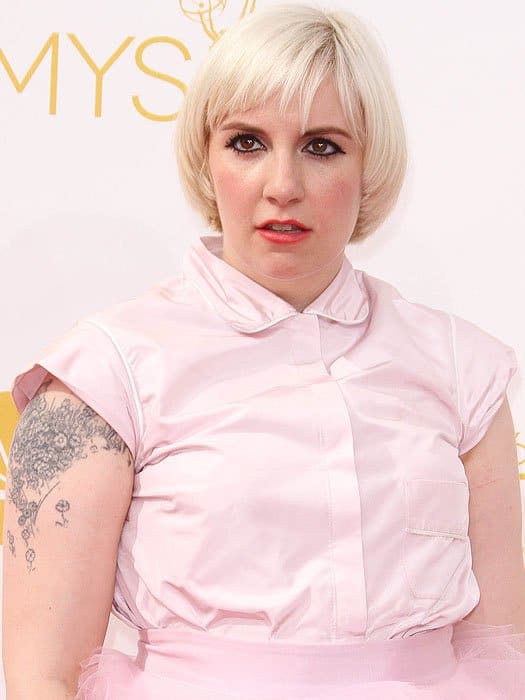 Lena Dunham showcased a bold platinum bowl cut and strikingly outlined eyes