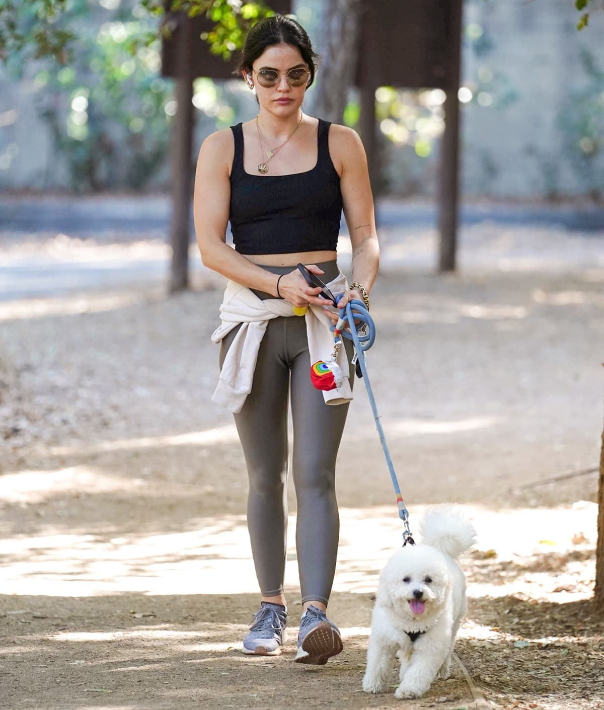 Wearing Nike Air Zoom Pegasus 36 sneakers, Lucy Hale walks her dog, Elvis, in Los Angeles