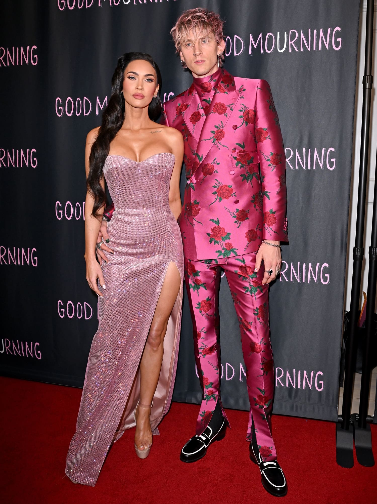 Megan Fox in a strapless pink Philosophy di Lorenzo Serafini dress and Machine Gun Kelly in a pink Dolce & Gabbana suit at the premiere of their new film Good Mourning