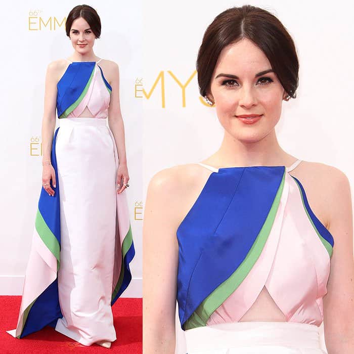 Michelle Dockery stuns in a Rosie Assoulin color-block gown paired perfectly with a sleek low chignon, exuding effortless elegance on the red carpet
