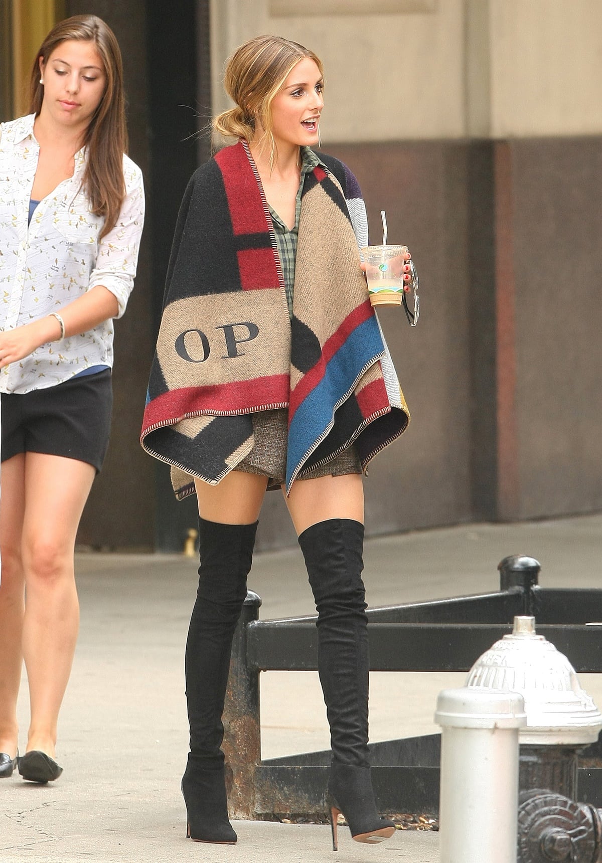 Socialite Olivia Palermo wears a Burberry color block check blanket poncho and Aquazzura X Olivia Palermo All I Need thigh boots