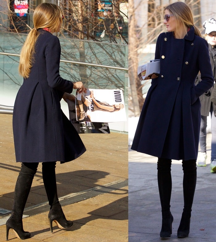 Olivia Palermo wears black suede over-the-knee boots and a blue coat