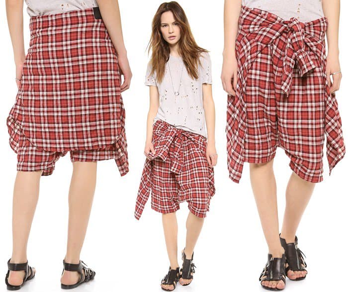 Beyoncé's red plaid R13 flannel shorts feature a playful trompe-l'œil design with an attached shirt tied at the waist, embodying grunge style