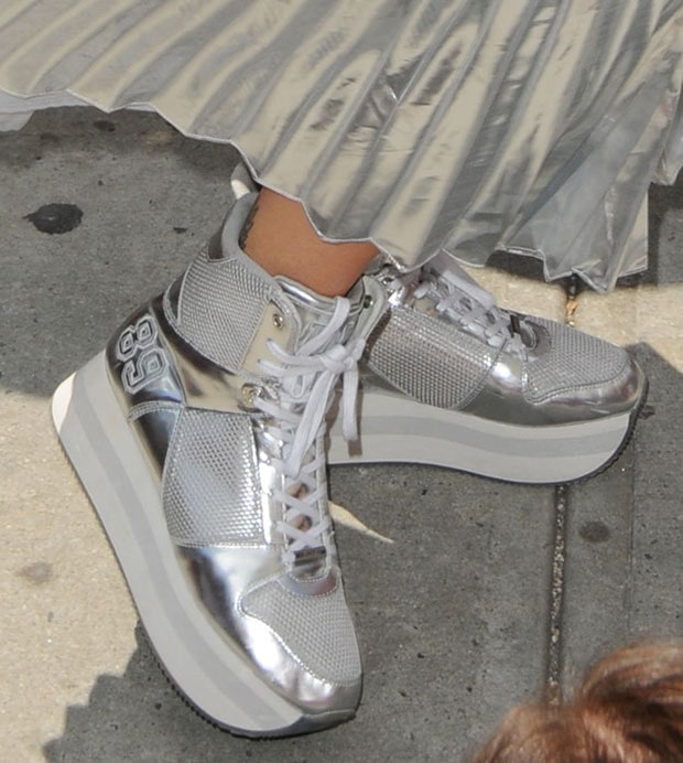 Rita completed her space-age outfit with a pair of platform hi-cut sneakers called the “Jansen,” also by DKNY