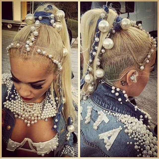 Rita Ora's intricate pearl-adorned hairstyle and customized denim jacket at the 2014 V Festival