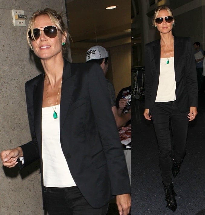 Heidi Klum opted for a monochromatic ensemble consisting of black skinny jeans worn with a white shirt and a black blazer