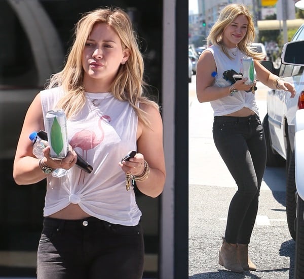 Hilary Duff paired the chic boots with a low-key look that included a white tee and black skinny jeans