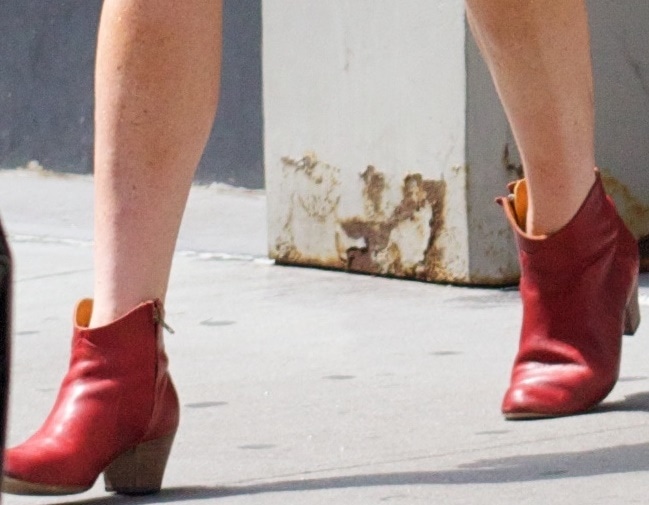 Lindsay Lohan wearing poppy Dicker red ankle boots