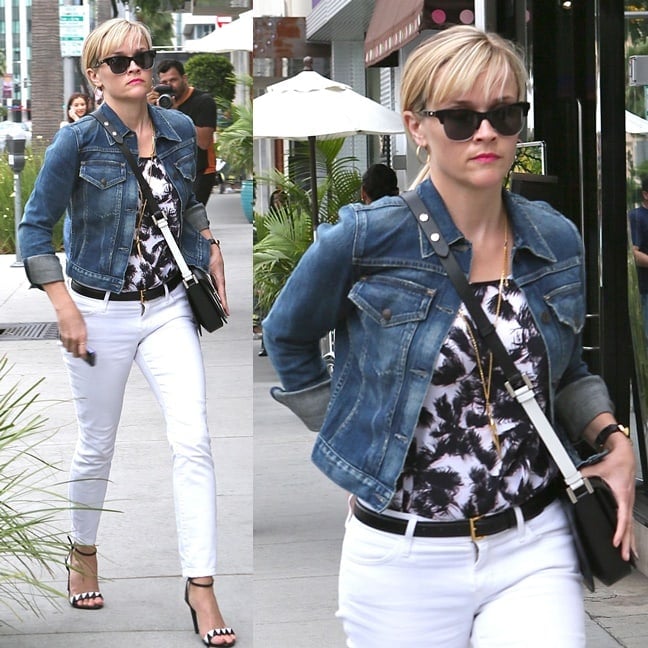 Reese Witherspoon shows how to elevate a black-and-white outfit with a classic denim jacket and strappy heels for a chic yet effortless shopping day look