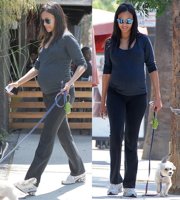 Zoe Saldaña walking her dog in a pair of worn-in Nike running shoes