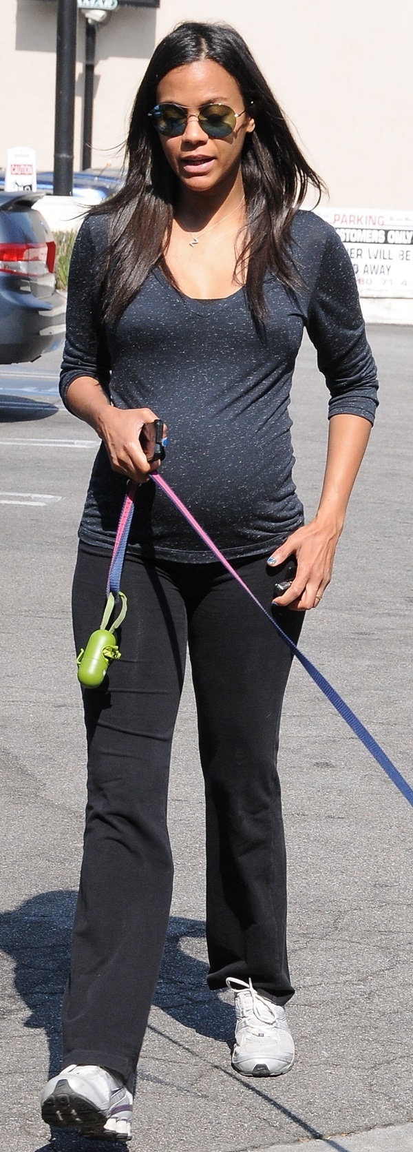 Zoe Saldana wearing a pair of comfortable Nike running shoes while walking her dog in Studio City, California, on August 21, 2014