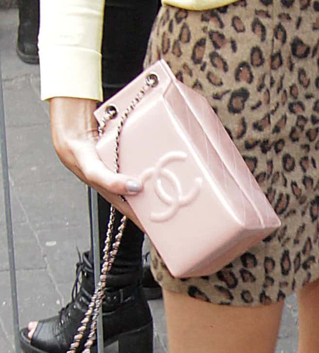 The Chanel Milk Carton bag measures 3.5" length x 8" height x 3.5" width