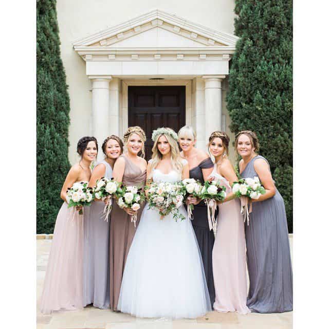 Ashley looked radiant in her traditional wedding gown, surrounded by her bridesmaids in beautifully coordinated pastel dresses