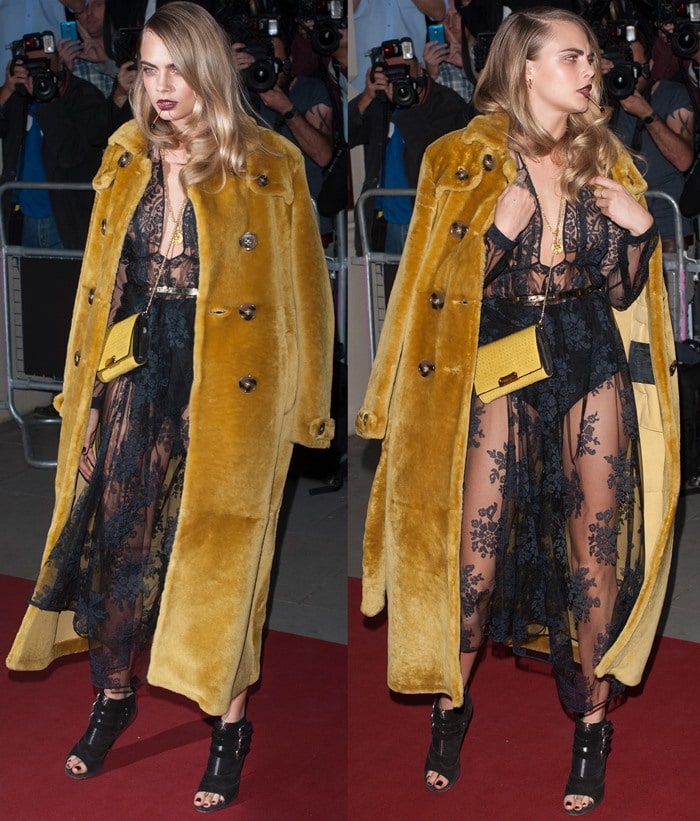 Elegantly styled in a black floral embroidered dress complemented by a luxurious gold fur coat, Cara Delevingne defines sophistication with a matching yellow leather clutch and black peep-toe booties