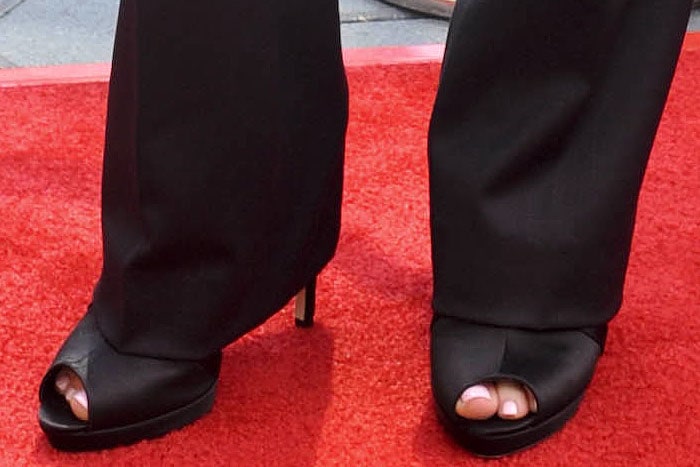 Black satin peep-toe platform sandals on Elle Fanning