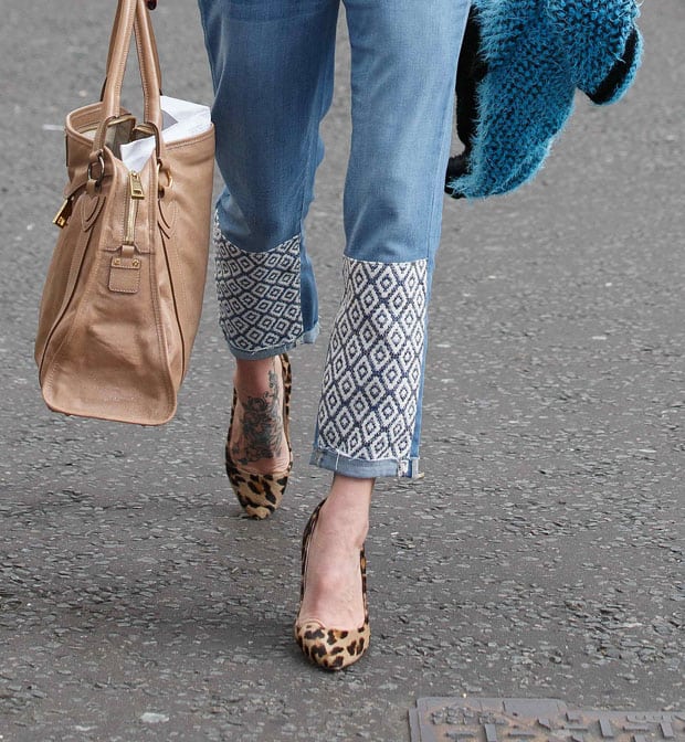 Fearne Cotton's jeans feature intricate patchwork details on the lower legs, perfectly complemented by her chic animal print pumps