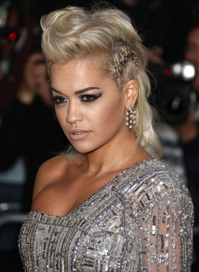 Rita Ora dazzles with her platinum faux-hawk and elegant chandelier earrings at the GQ Men of the Year Awards