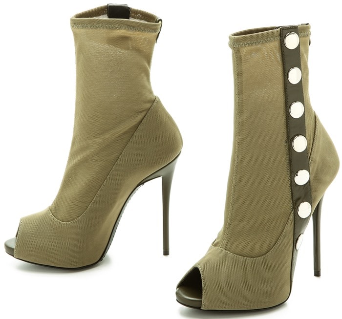 Stretch mesh composes these fitted, edgy Giuseppe Zanotti booties, and a column of polished, silver-tone snaps add a military-inspired feell