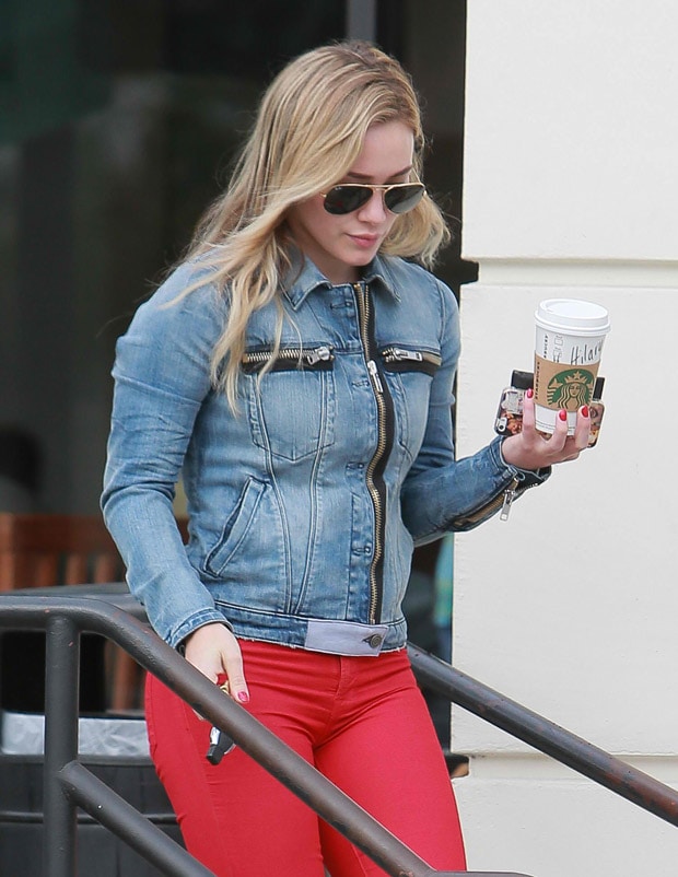 Hilary Duff in red J Brand Super Skinny jeans grabs a coffee from Starbucks