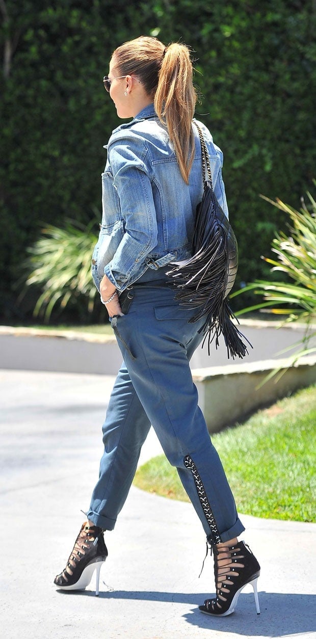 Jennifer Lopez wears wearing Isabel Marant Den cotton-blend tapered pants and a denim jacket