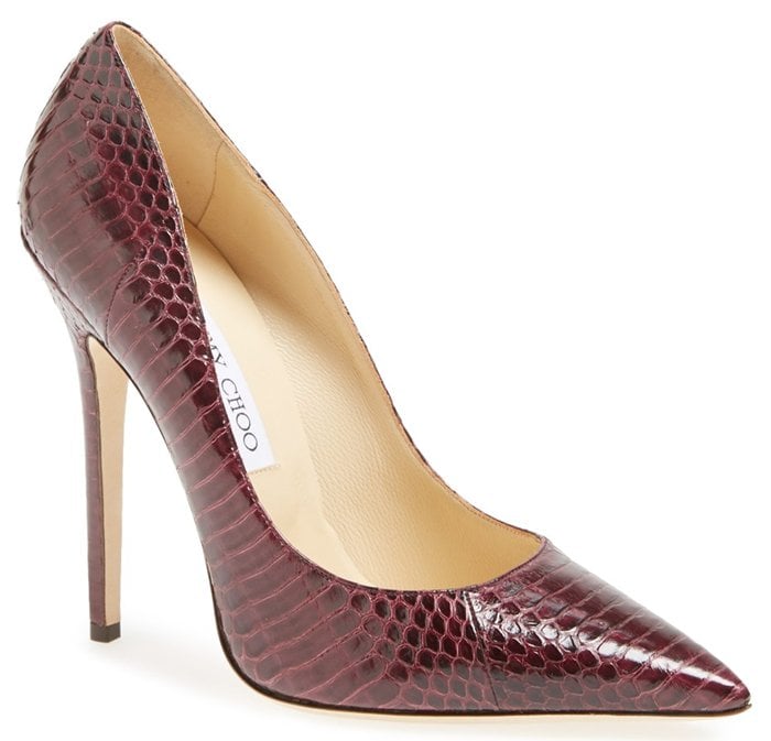 An impeccably handcrafted pump is rendered in rich, genuine snakeskin and lifted with a leg-lengthening heel for an impossibly sophisticated look